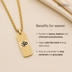Gold necklace with Om symbol pendant on beige background, featuring BLUMRA branding.